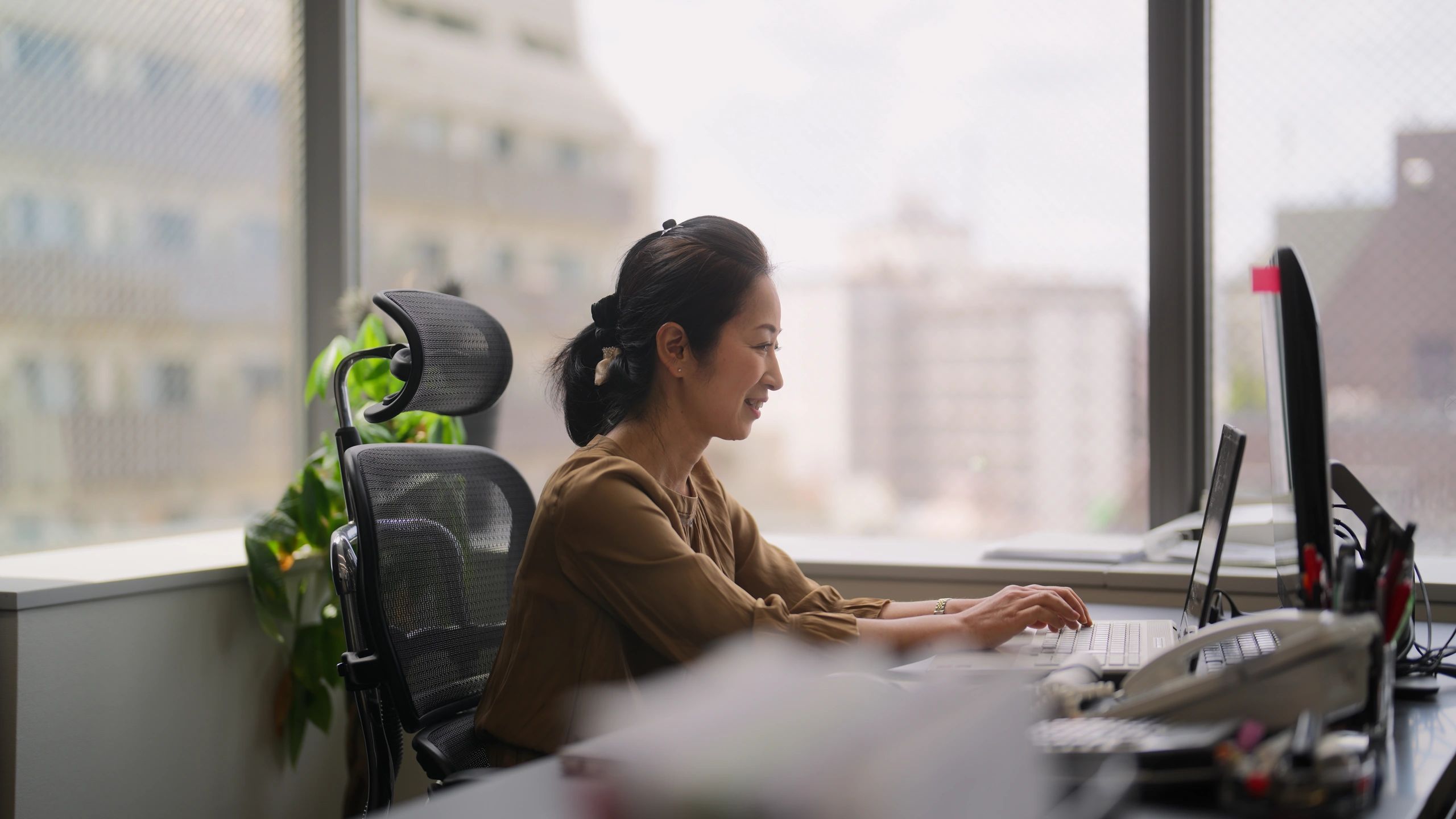 Professional woman on a video conference in an office