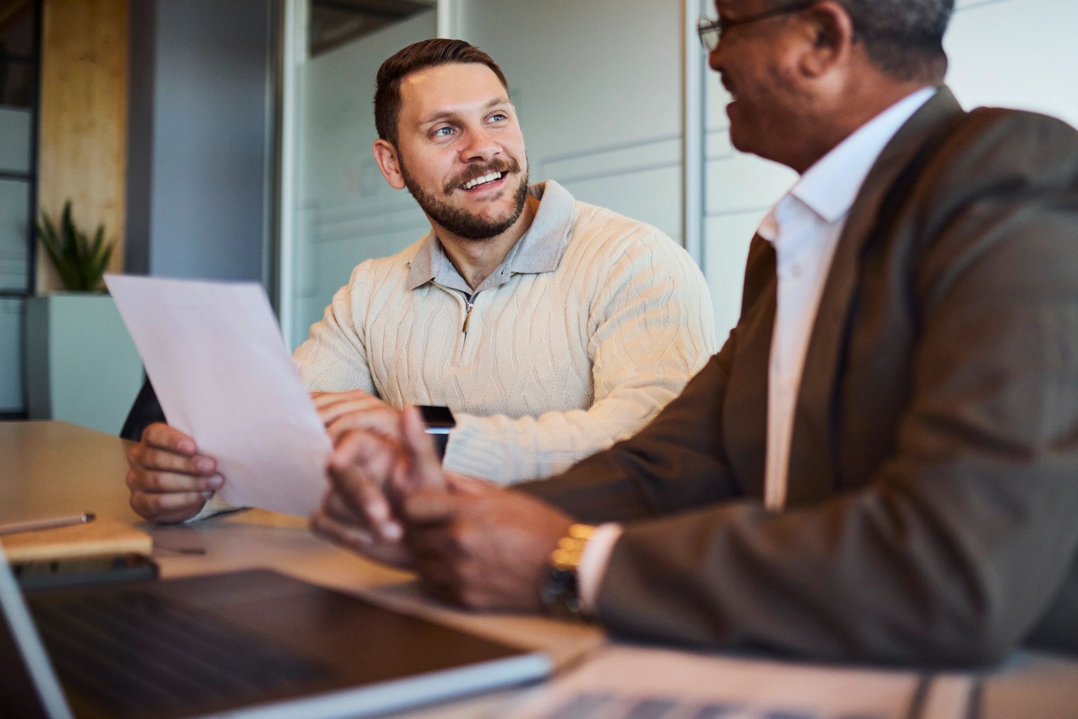 Bookkeeping consultation with two professionals reviewing paperwork
